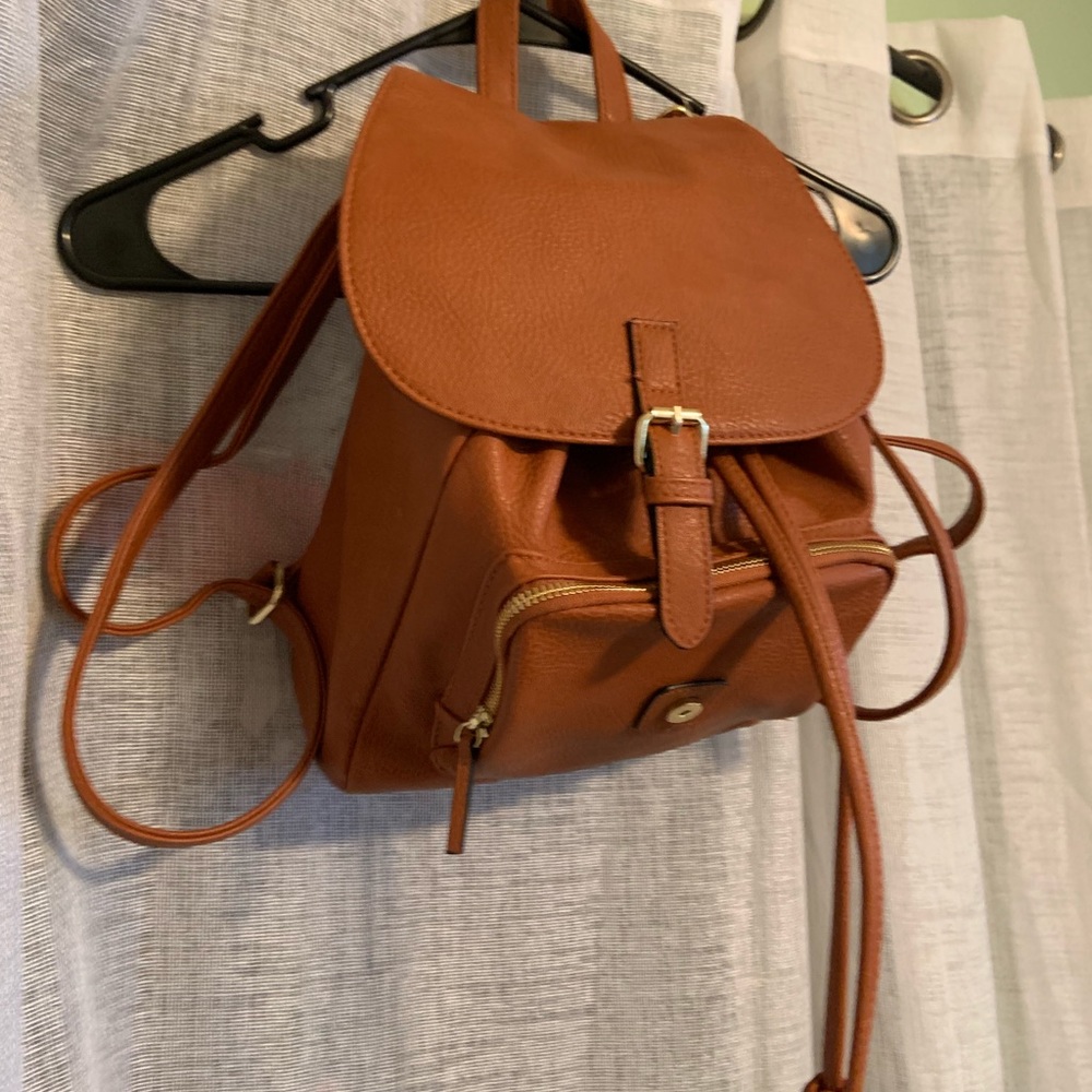 Faux leather backpack purse with gold accents